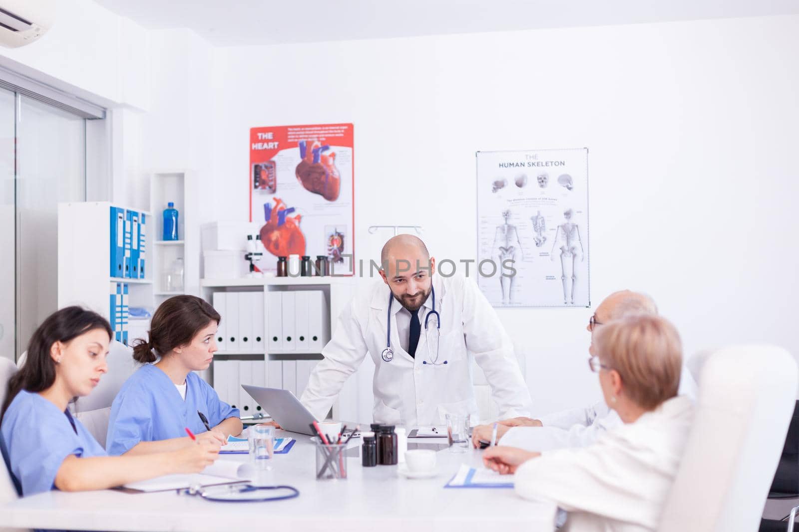 Doctor having professional discussion by DCStudio
