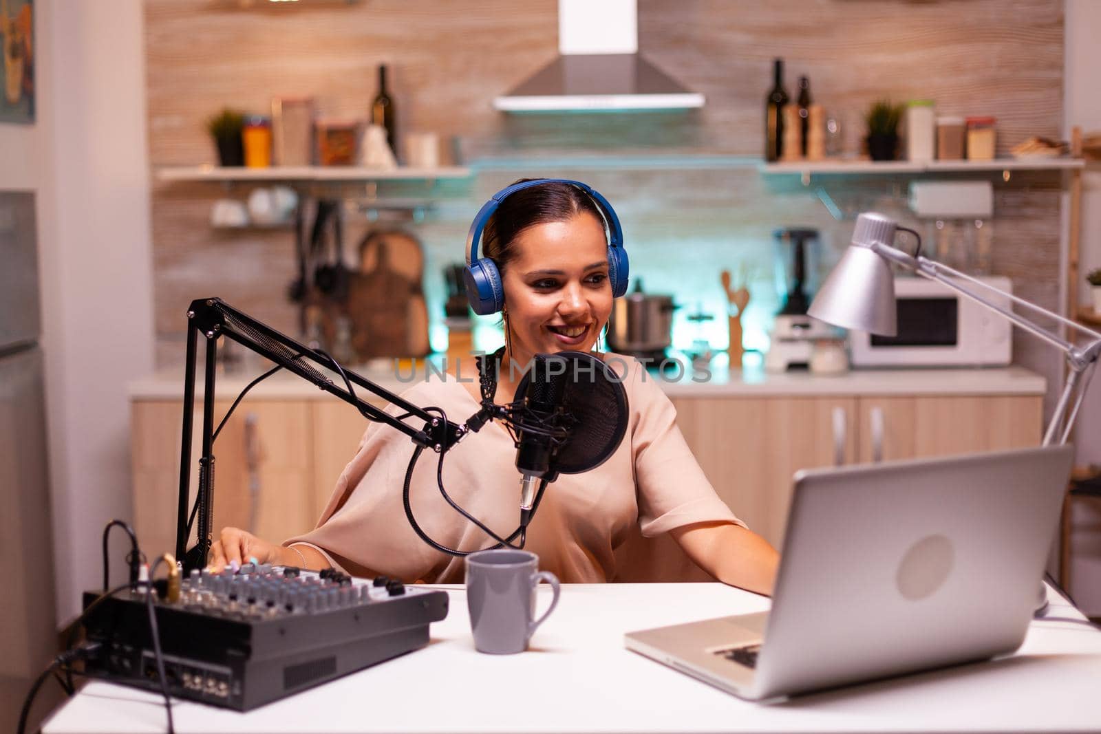 Famous influencer hosting online show in home studio using professional gear. Online show On-air production internet broadcast host streaming live content recording digital social media communication