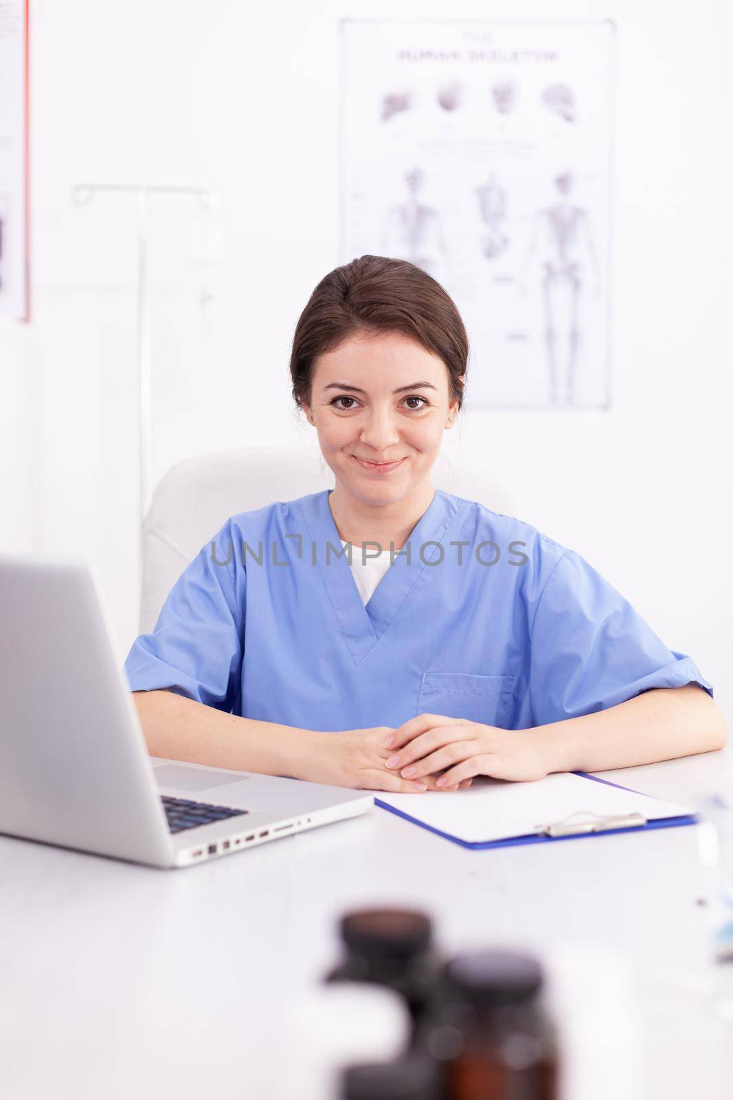 Portrait of healthcare nurse smiling by DCStudio