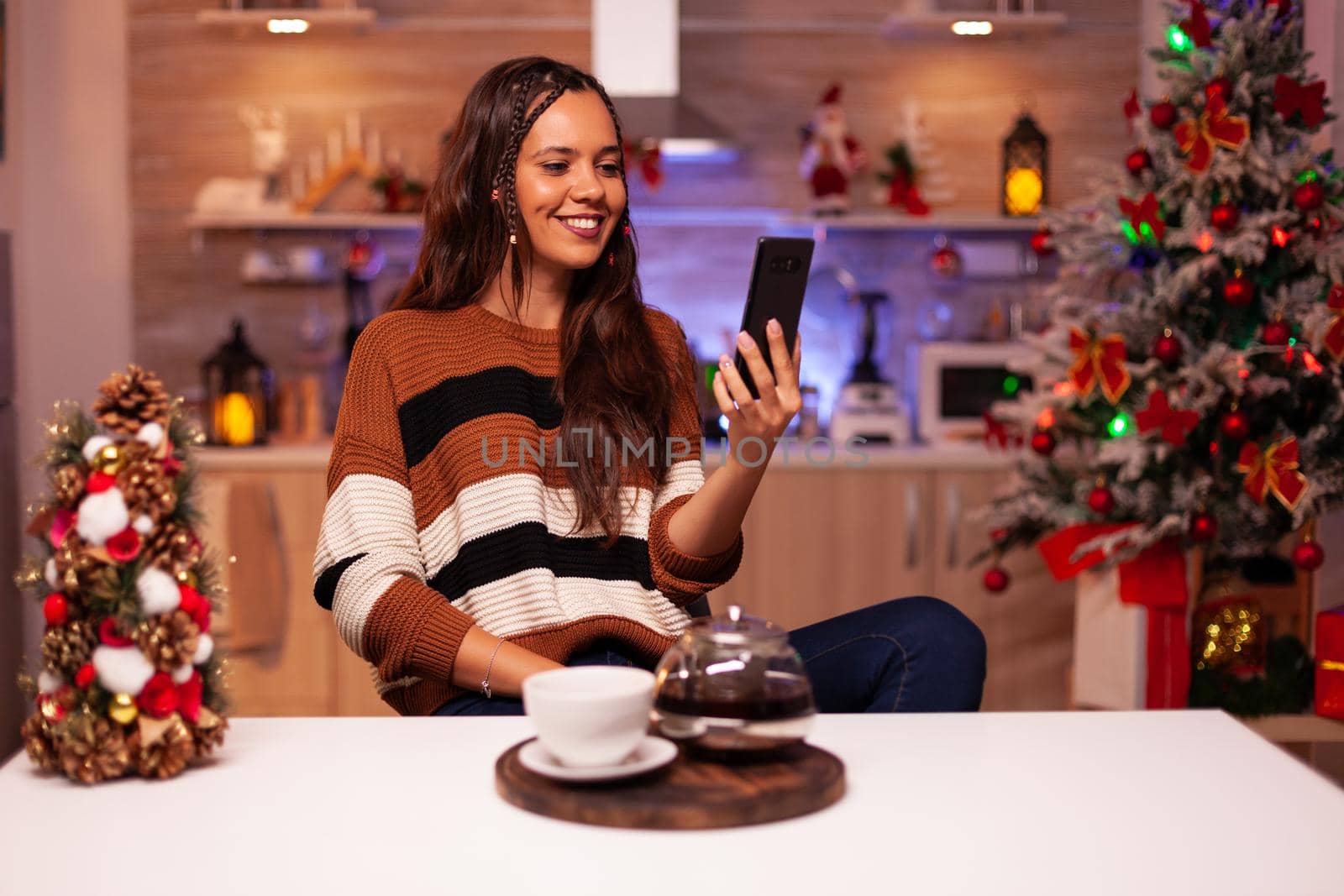 Adult woman with smartphone for video call conference by DCStudio