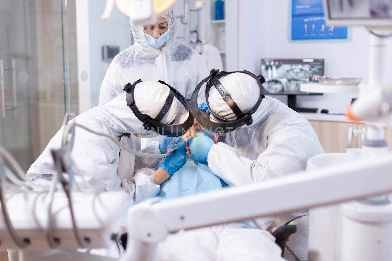 Little girl during dentist visit getting oral hygine treatment by DCStudio