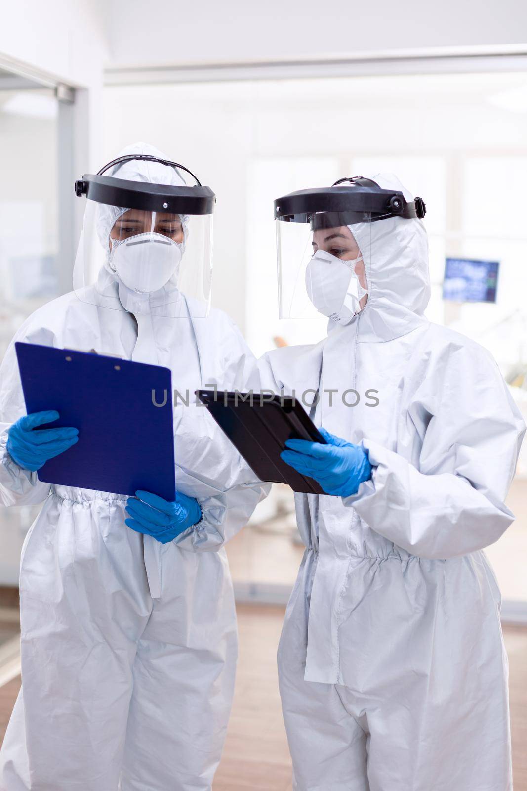 Doctor personal in ppe suit during globald pandemic by DCStudio