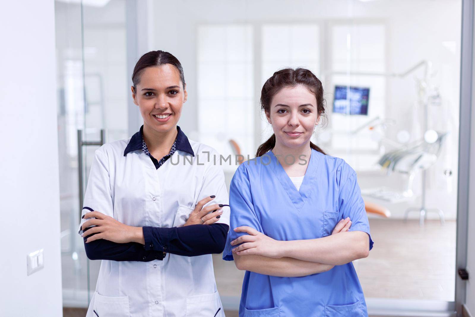 Portrait of smiling dentist and nurse smiling by DCStudio