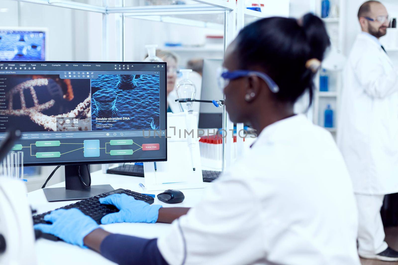 Multiethnic researcher team doing investigation in modern facility. African healthcare scientist in biochemistry laboratory wearing sterile equipment.