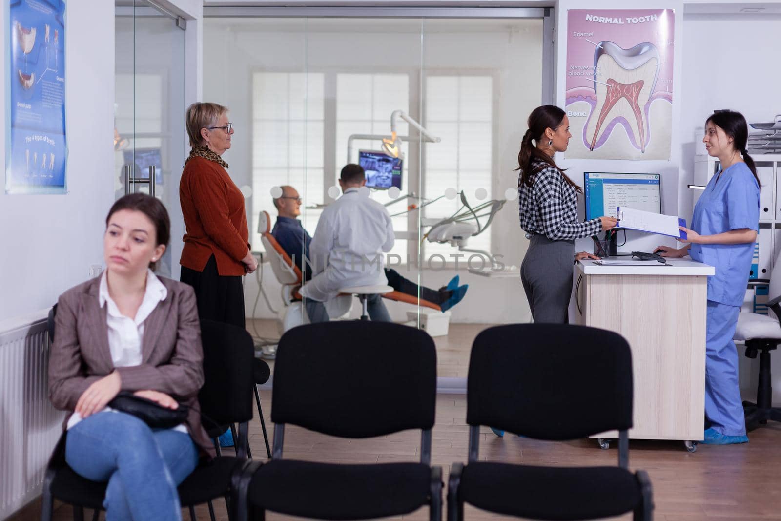 Patients in stomatology reception waiting in line by DCStudio
