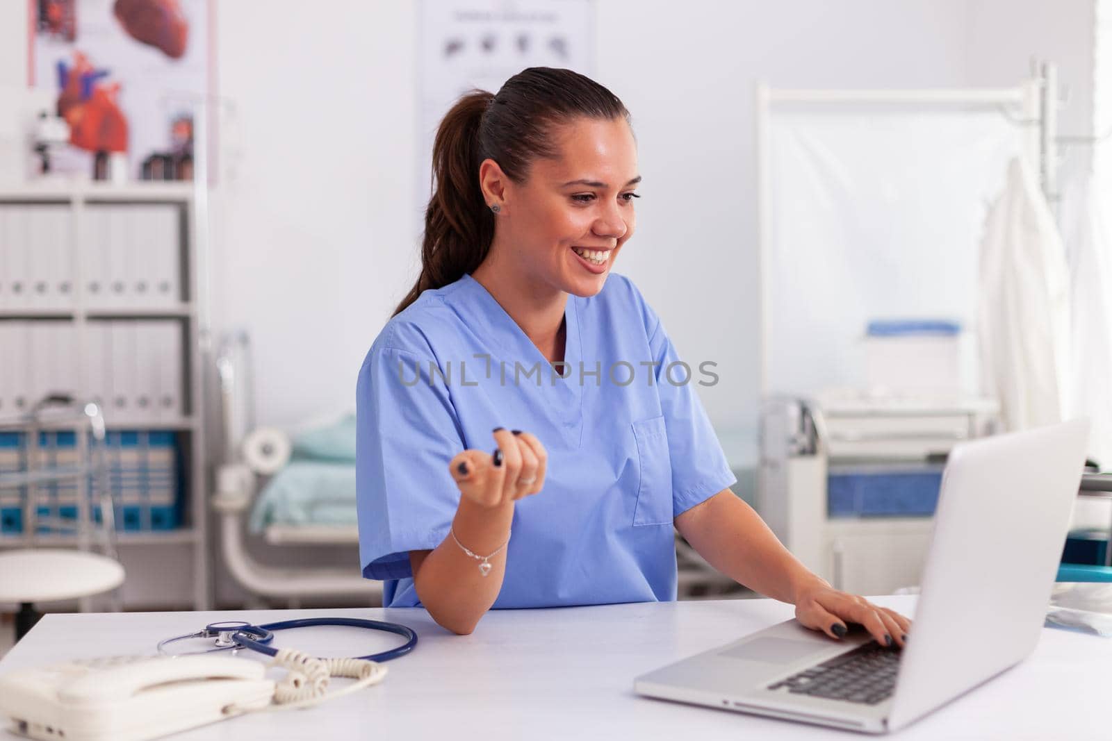 Medical nurse smiling by DCStudio