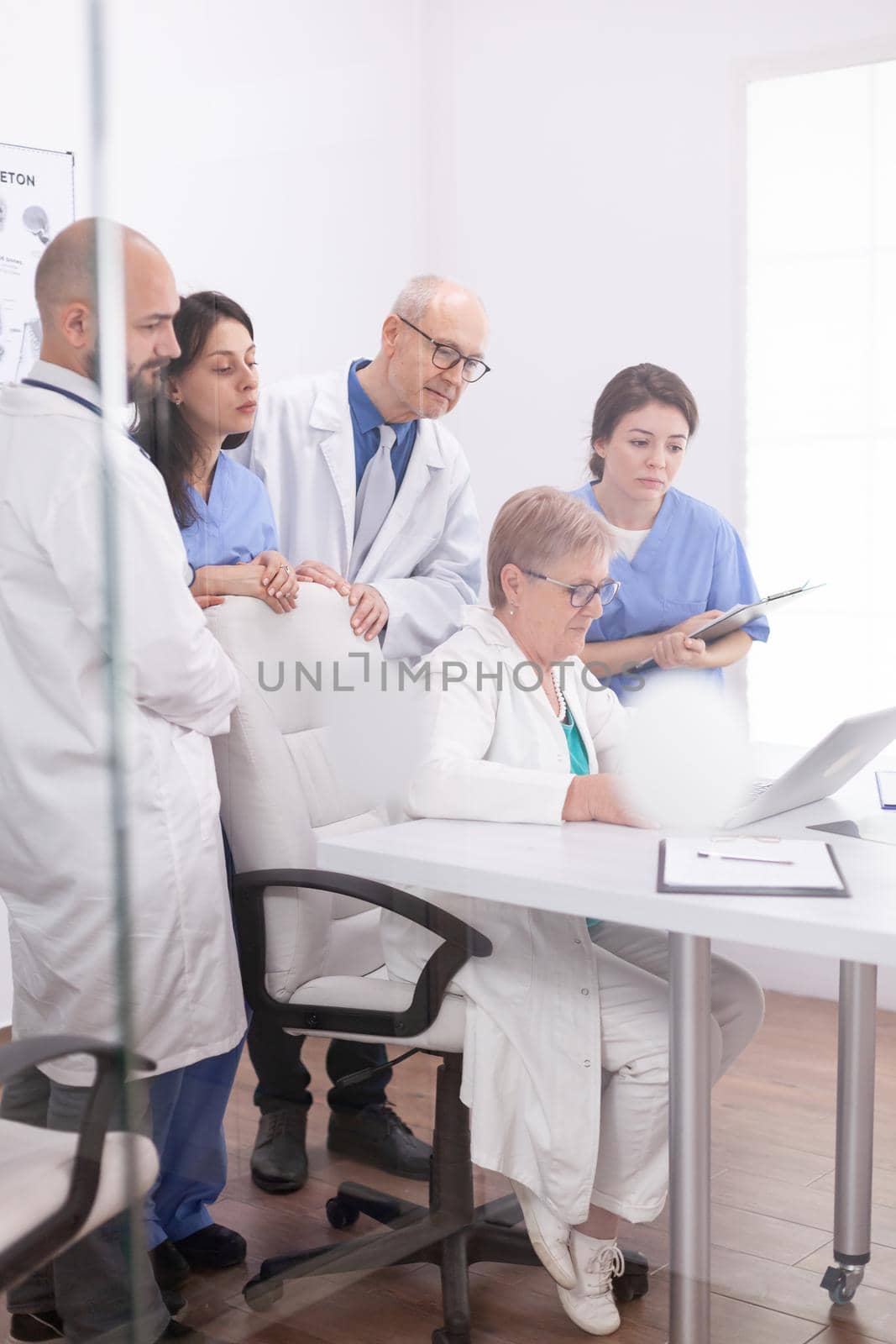 Medical team having a discussion by DCStudio