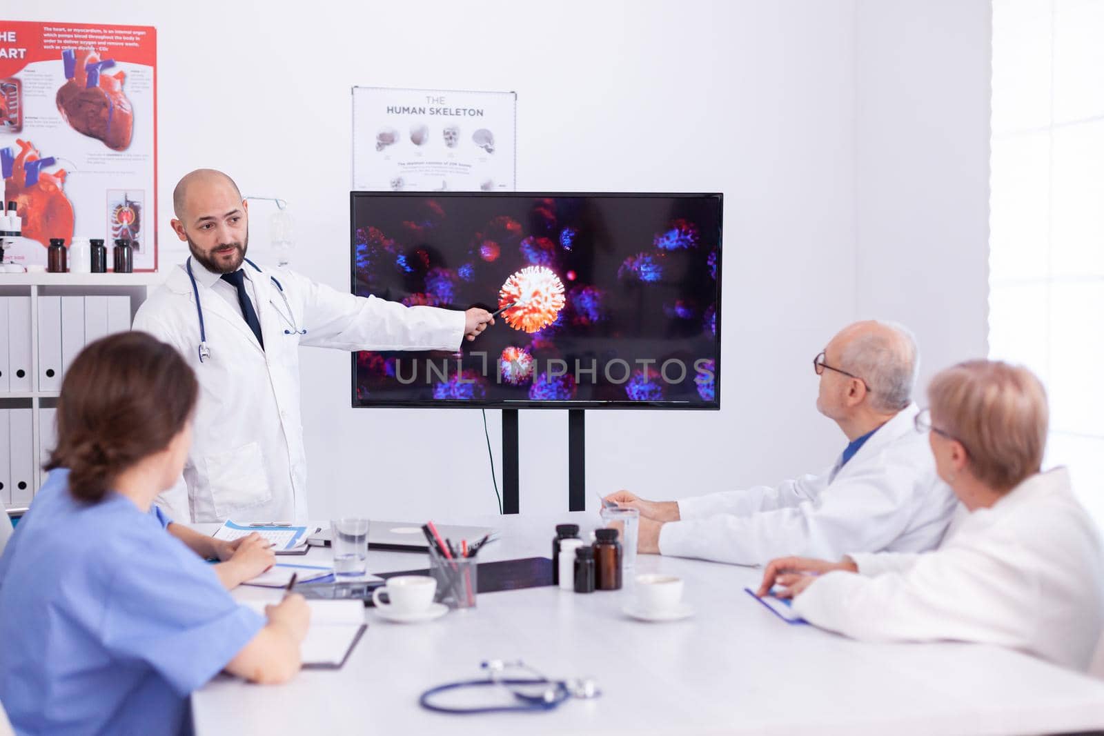 Doctor holding presentation by DCStudio