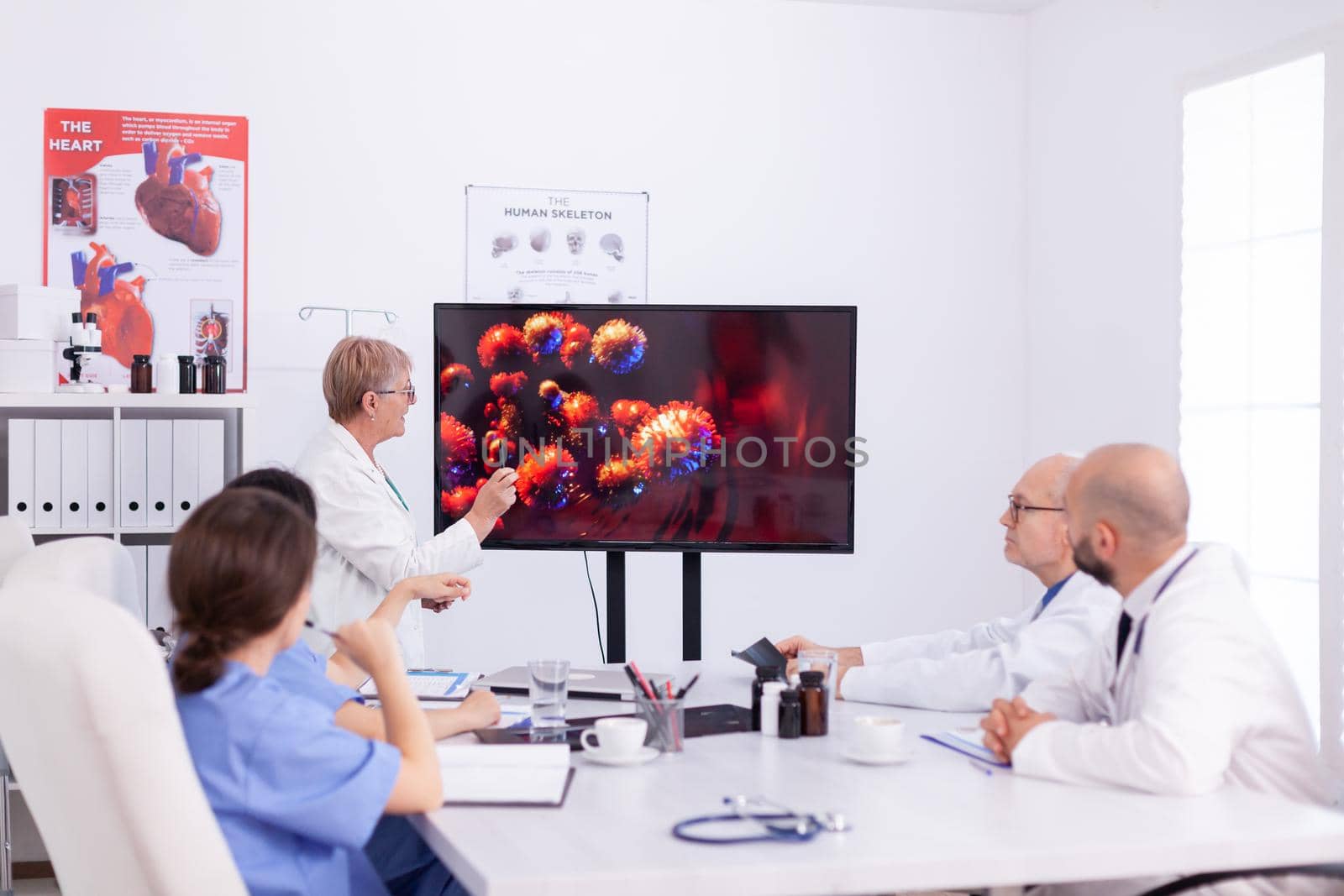 Medical colleagues discussing about coronavirus by DCStudio