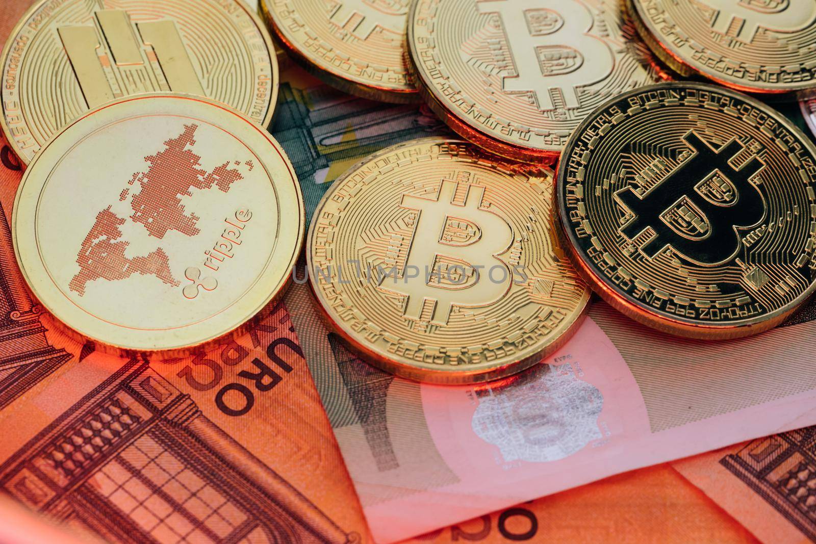 Bitcoins on euro banknotes. Bitcoin. Cryptocurrency, bitcoin and money. Exchange bitcoin for the euro. Euro banknotes. Euro bills.