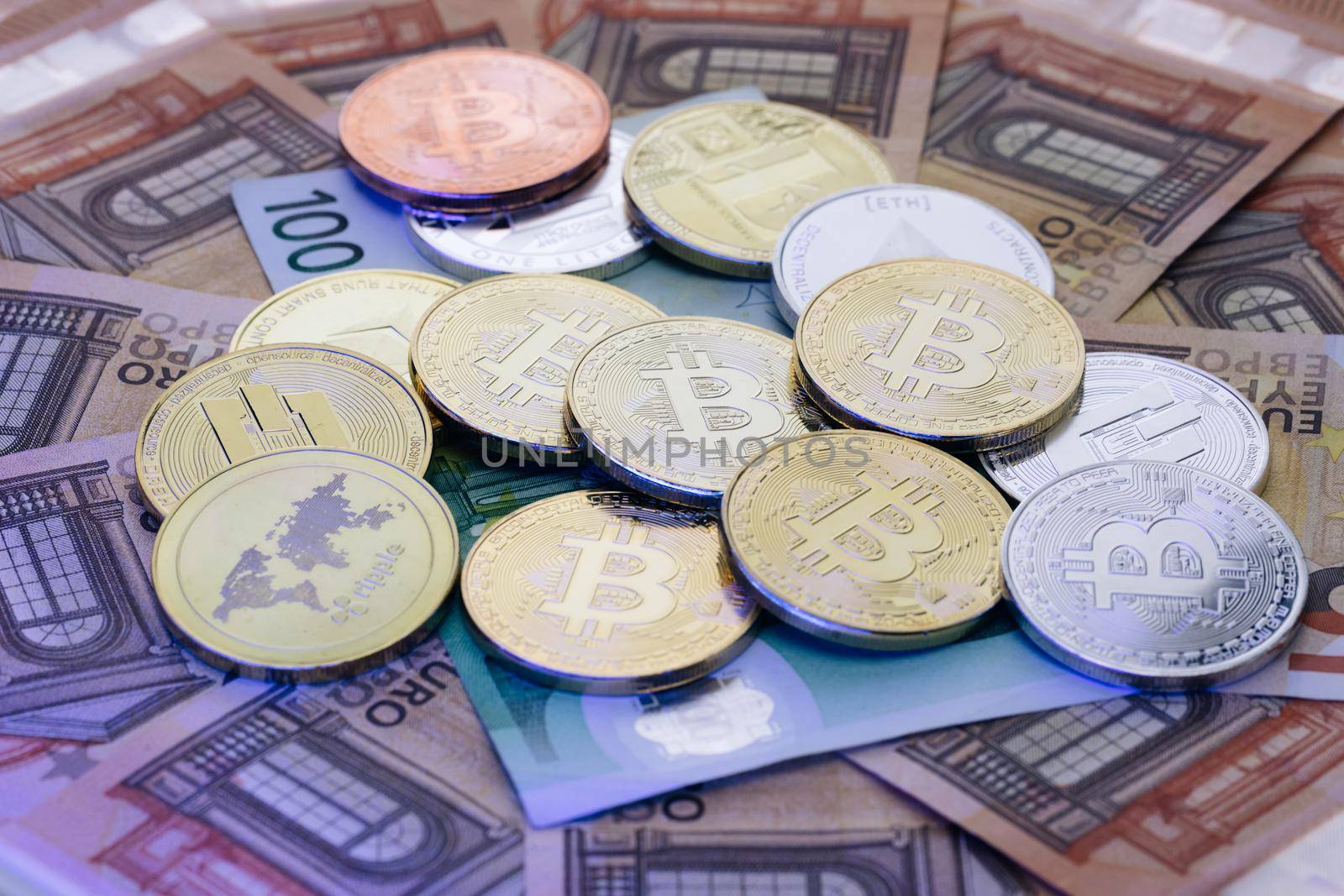 BitCoin BTC, Ethereum ETH and Litecoin LTC coins. Digital coin money on euro banknotes. Crypto currency, quotes online concept, stock exchange, exchange market