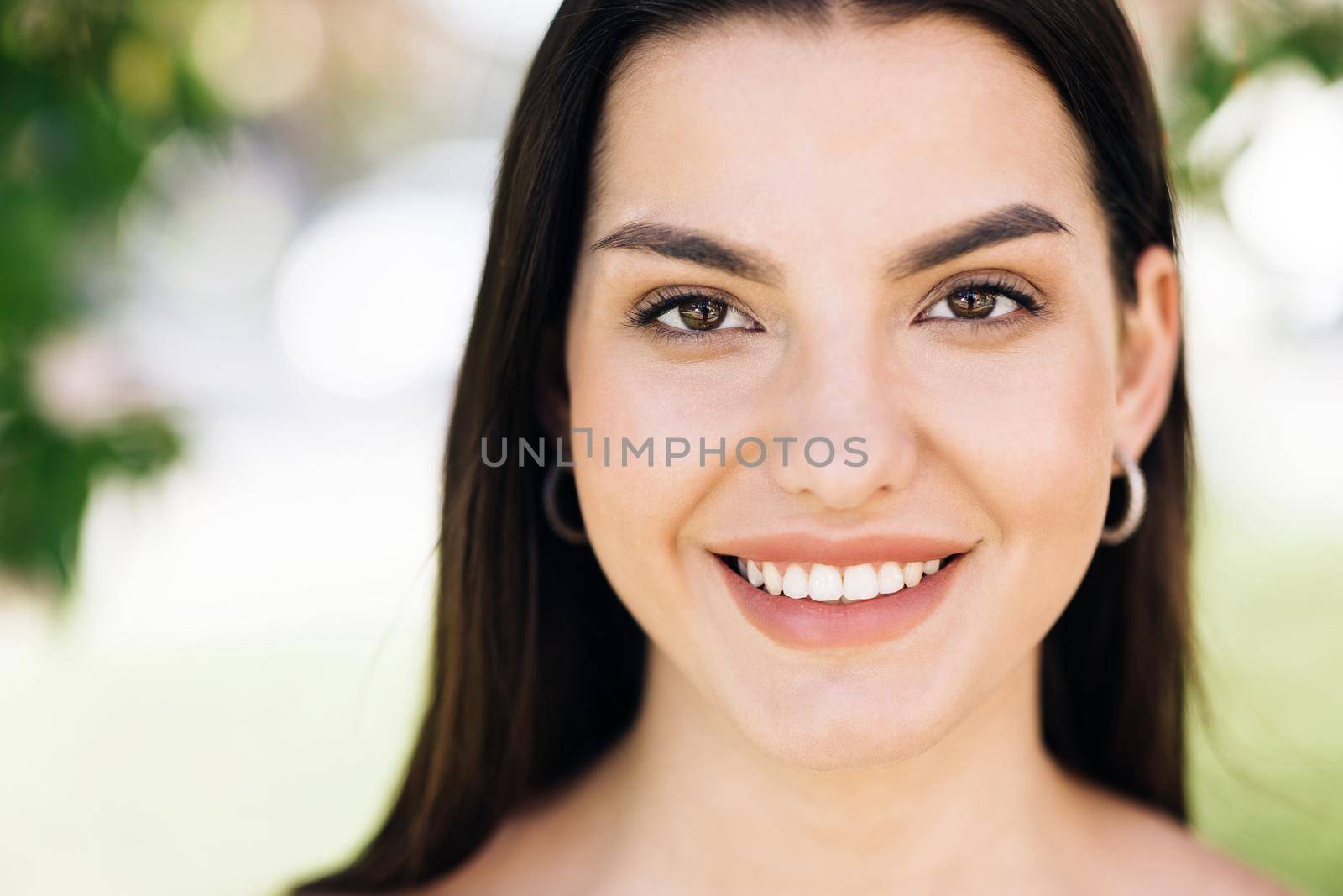 Smiling young woman in outfit looking to camera outside on street feel happy girl portrait beautiful modern woman pretty.