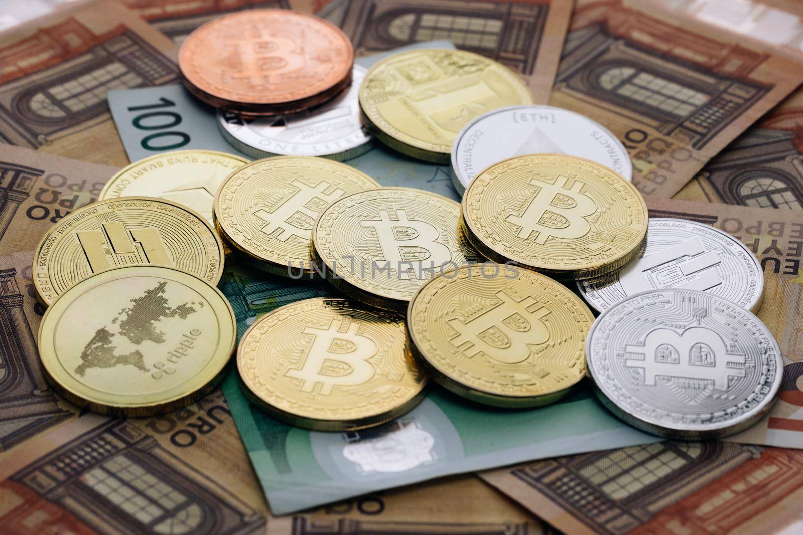 BitCoin BTC, Ethereum ETH and Litecoin LTC coins. Digital coin money on euro banknotes. Crypto currency, quotes online concept, stock exchange, exchange market