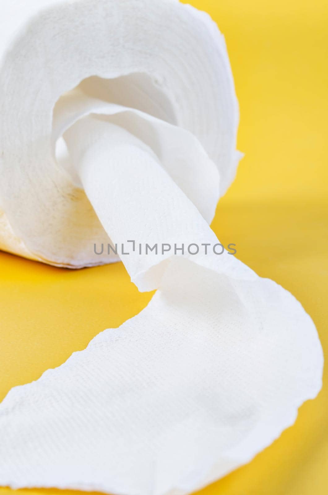 Close up the Tissue paper rolls on the yellow background.