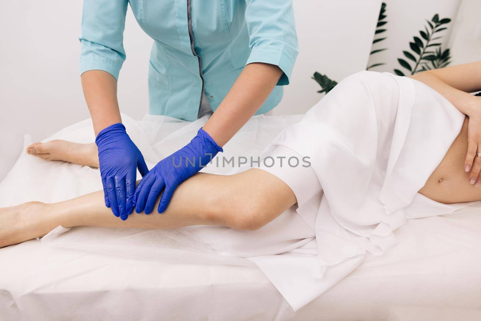 Young physiotherapist worker woman assisting physical medical exercise recovery after injuries. Rehabilitation. Treatment Healthcare Concept by uflypro