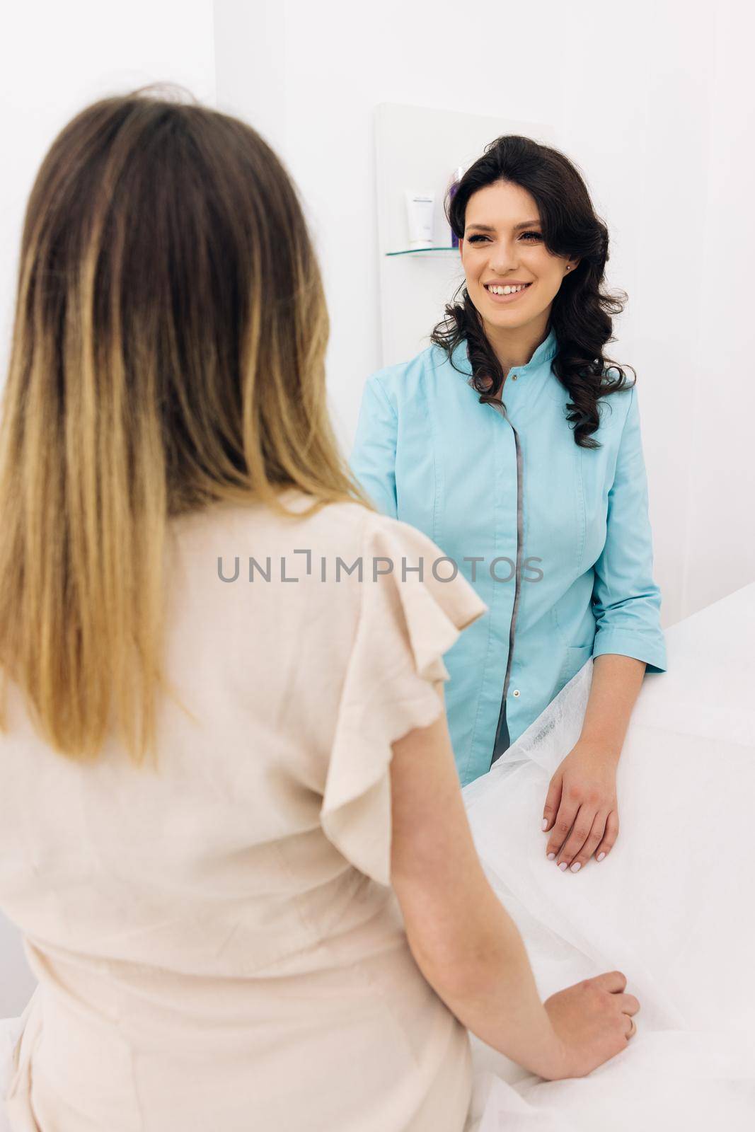 Family therapist female general practitioner worker during patient visit talking about upcoming treatment, test results. Health check up, medical insurance concept. by uflypro