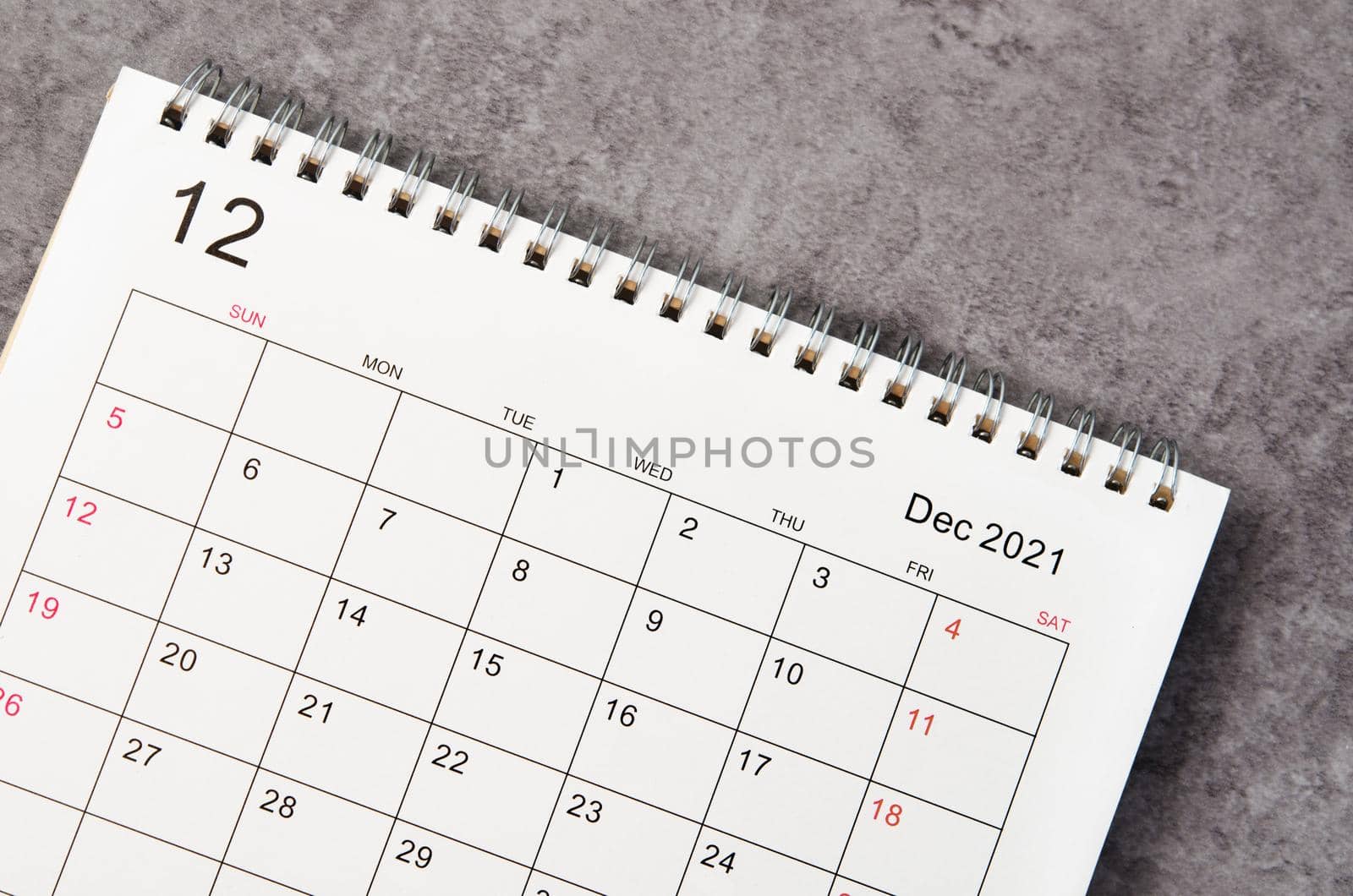 Close up December desk calendar 2022 on wooden background.