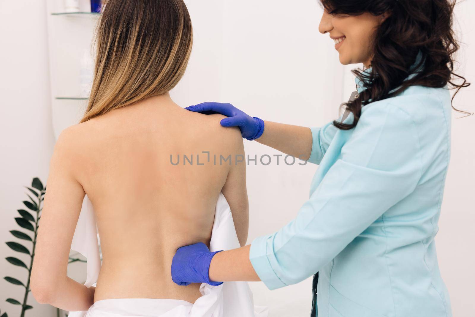 Physiotherapy Improves the Patient's Quality of Life. Doctor Collects a Complete Medical History of Back Problems and Performs a Detailed Physical Examination. by uflypro