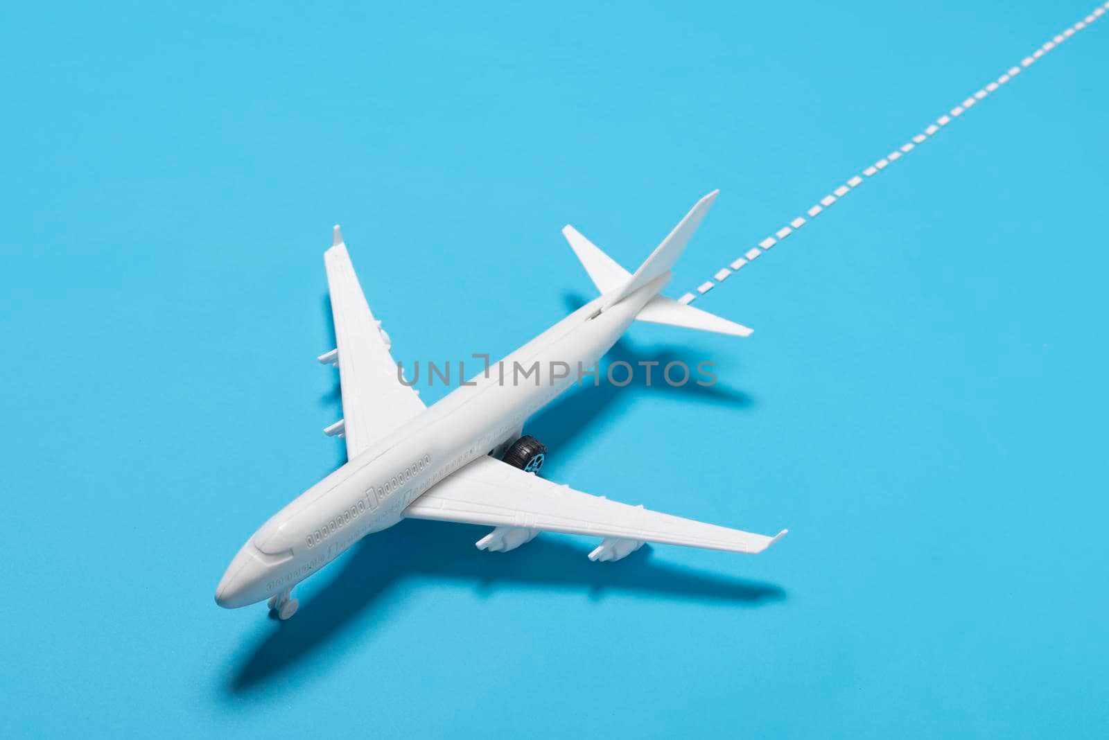 high angle plane blue background. High resolution photo