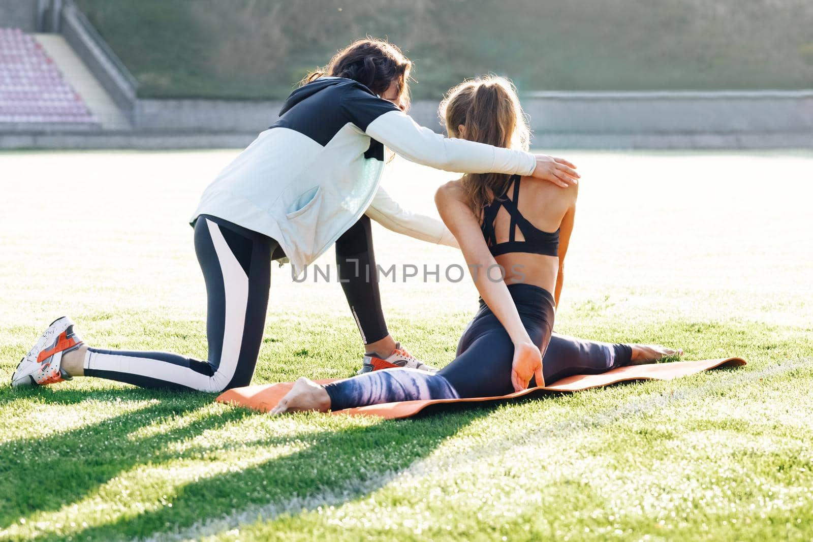 Physiotherapy and recovery. Rehabilitation concept. Physiotherapist expert checking of sportswoman physical treatment for rehabilitation. The doctor works on specific muscle groups or joints by uflypro