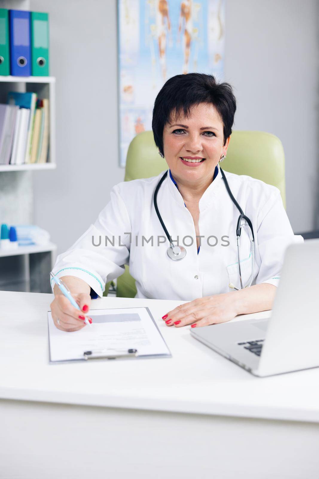 Confident woman wear white medical coat with stethoscope looking at camera. Happy lady professional medic clinic staff female nurse or doctor posing for close up portrait.