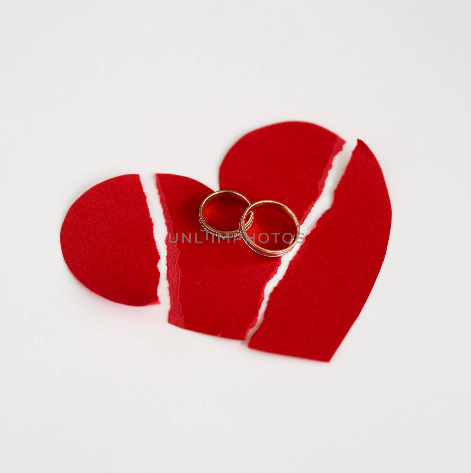marriage rings paper heart broken. High resolution photo