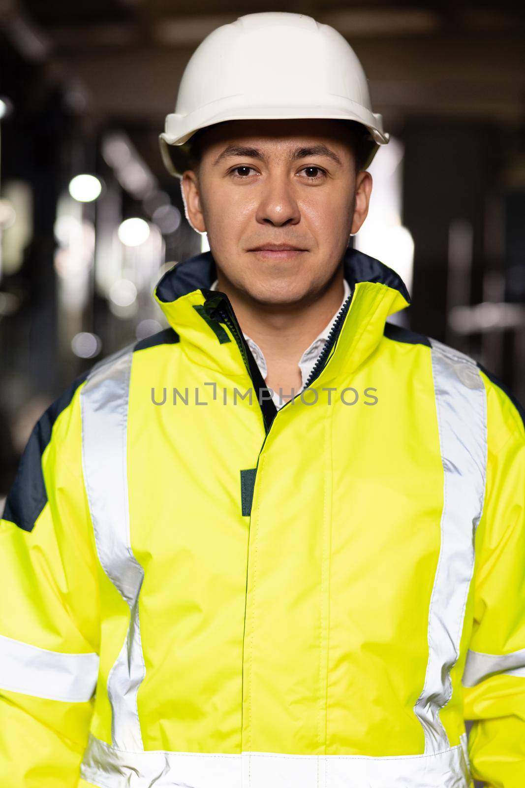 Portrait of Korean, Chinese Asian Professional Architect Engineer Man Businessman in Hard Hat Looking at Camera. Engineering Manufacture Plant Indoors, Worker inspection.