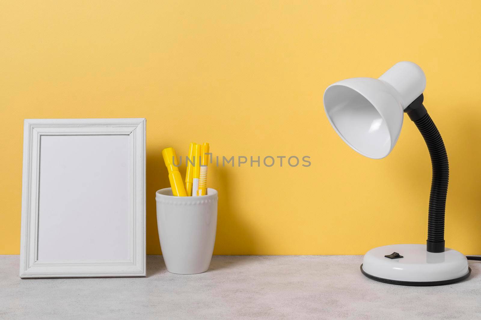 arrangement with desk lamp pens. High resolution photo
