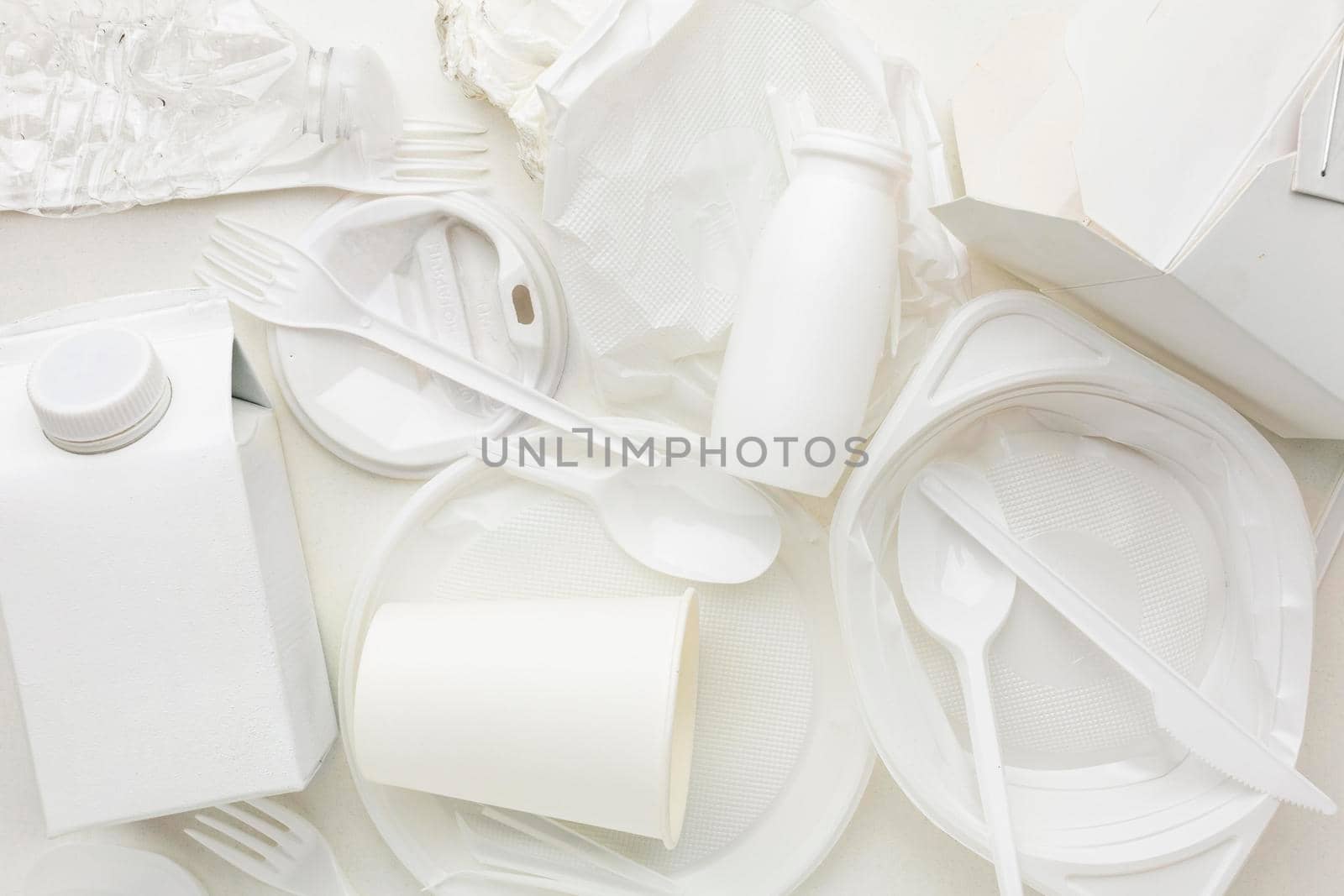 top view arrangement dirty plastic waste. High resolution photo