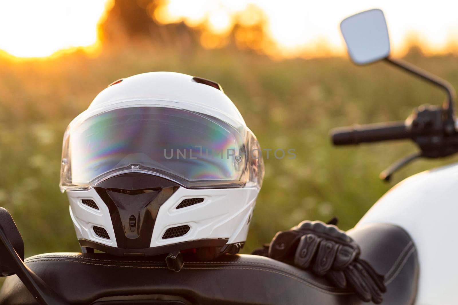 front view motorcycle helmet sitting bike. High resolution photo