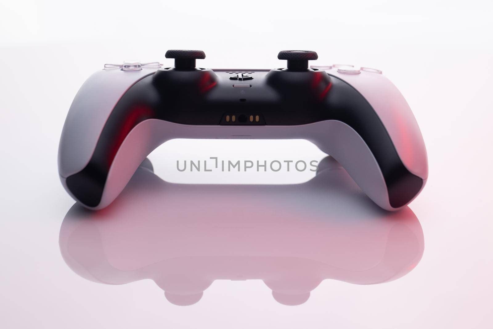 Kiev, Ukraine - January 1 2021: Sony Playstation 5 Dualsense game controller on a white background. New product from Sony, wireless white PlayStation 5 by uflypro