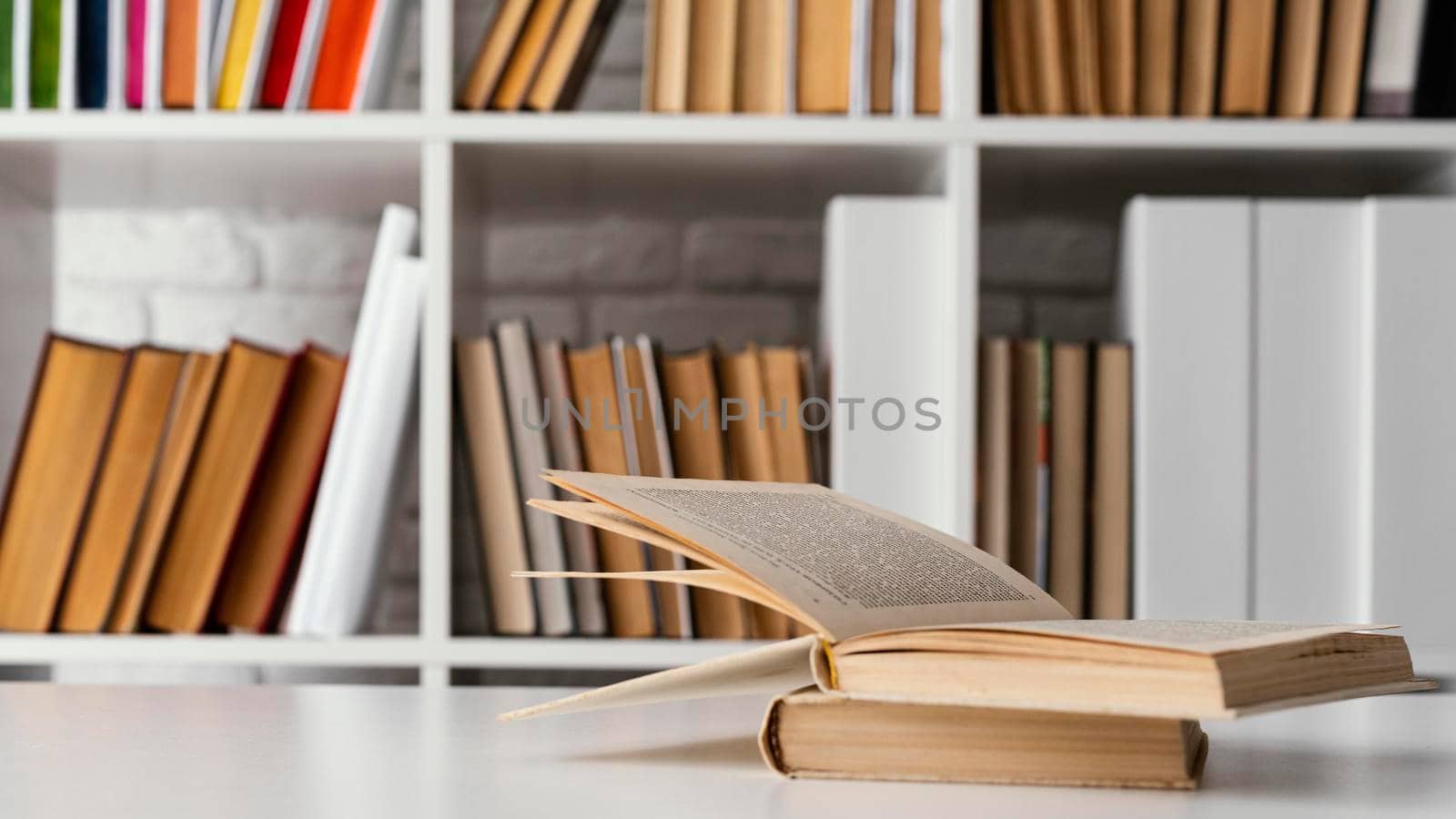 books shelf table arrangement. High resolution photo