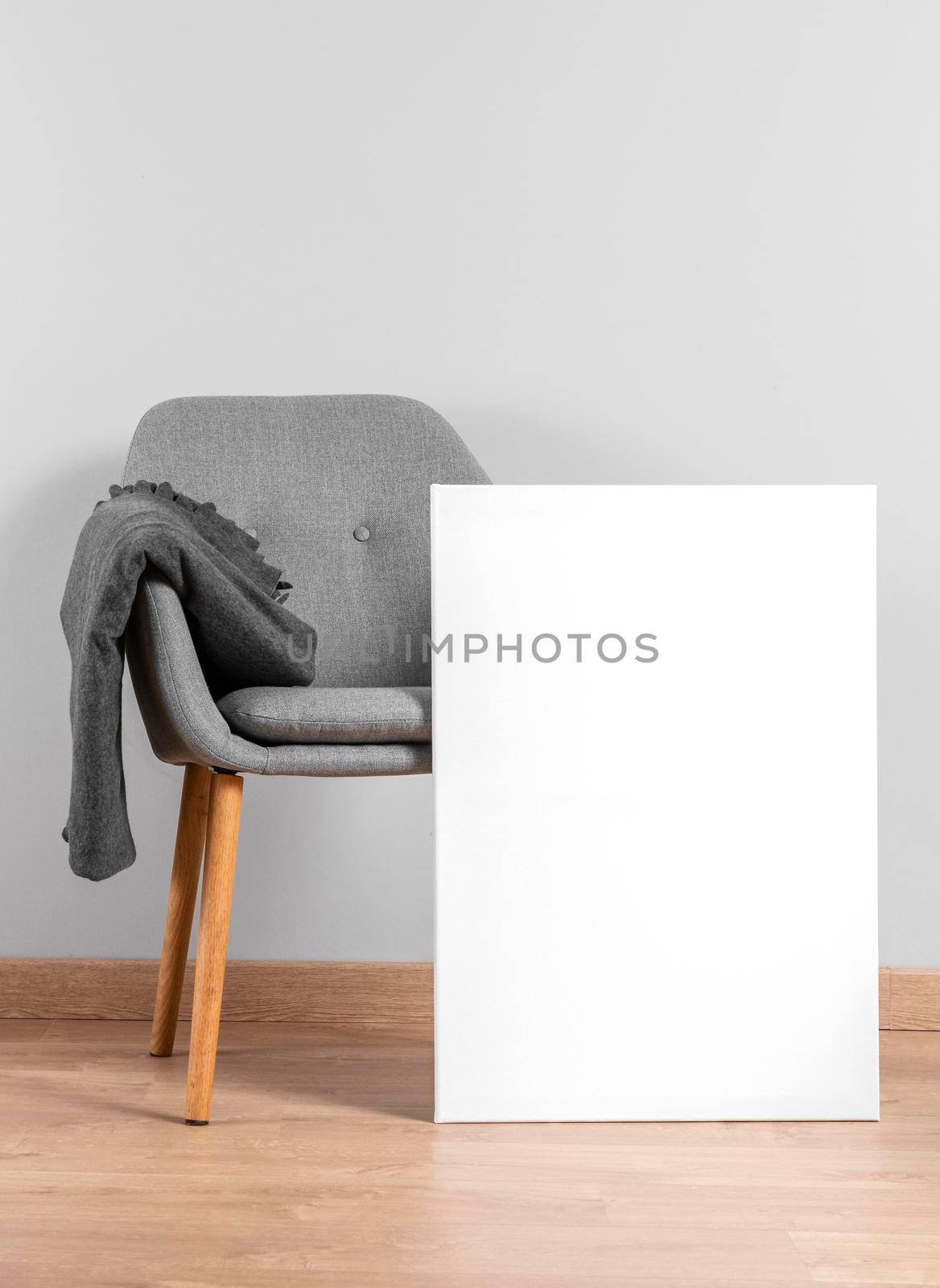 frame mock up beside chair. High resolution photo