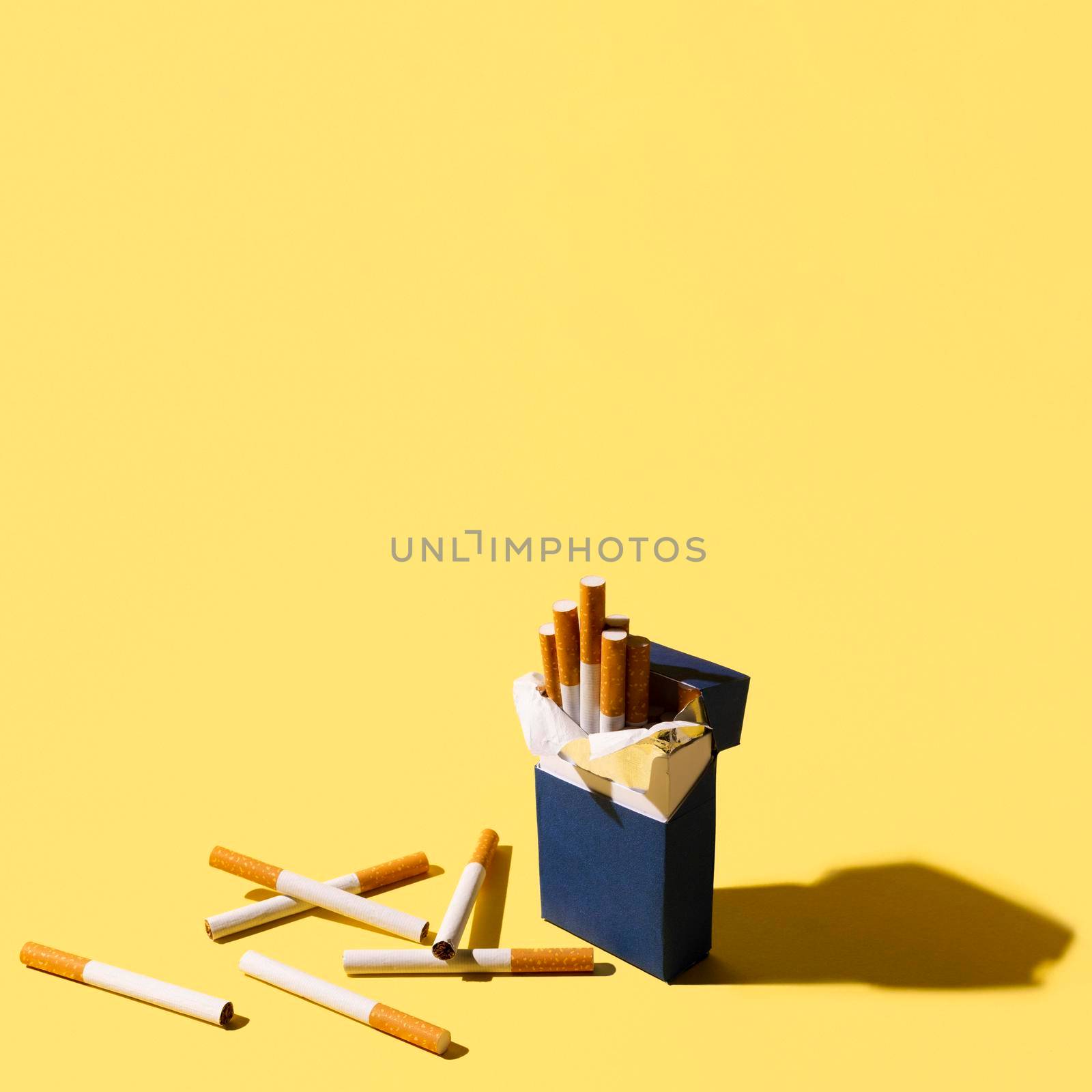 cigarettes pack yellow background. High resolution photo