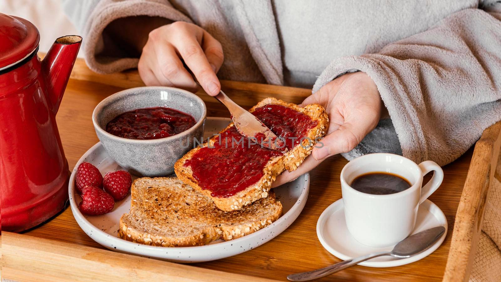 hand putting jam bread. High resolution photo