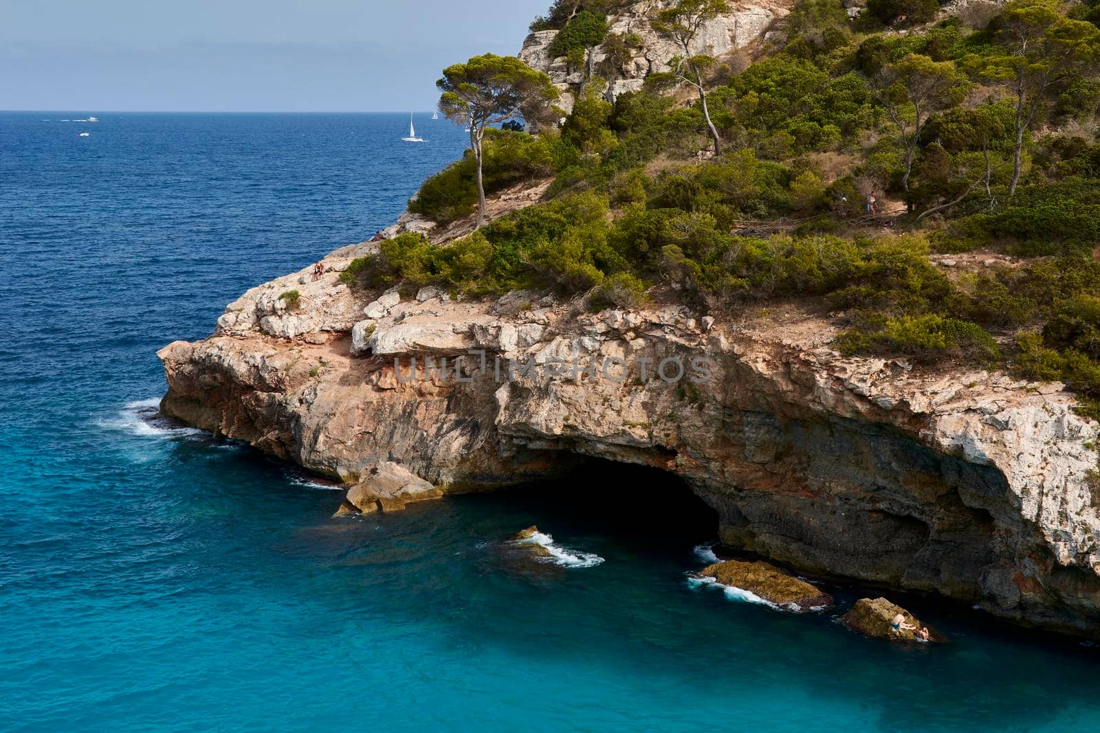 Paradise beach of the mediterranean sea, turquoise water, yes people, cliffs, rocks, white sand, Balearic Islands, Spain