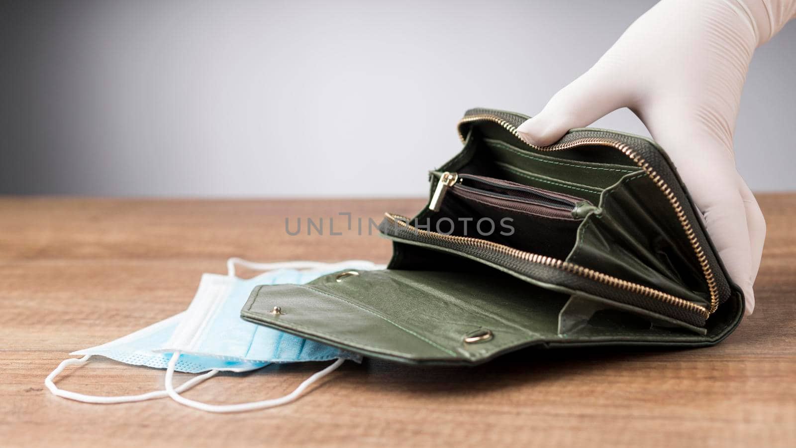 woman holding empty wallet face mask. High resolution photo