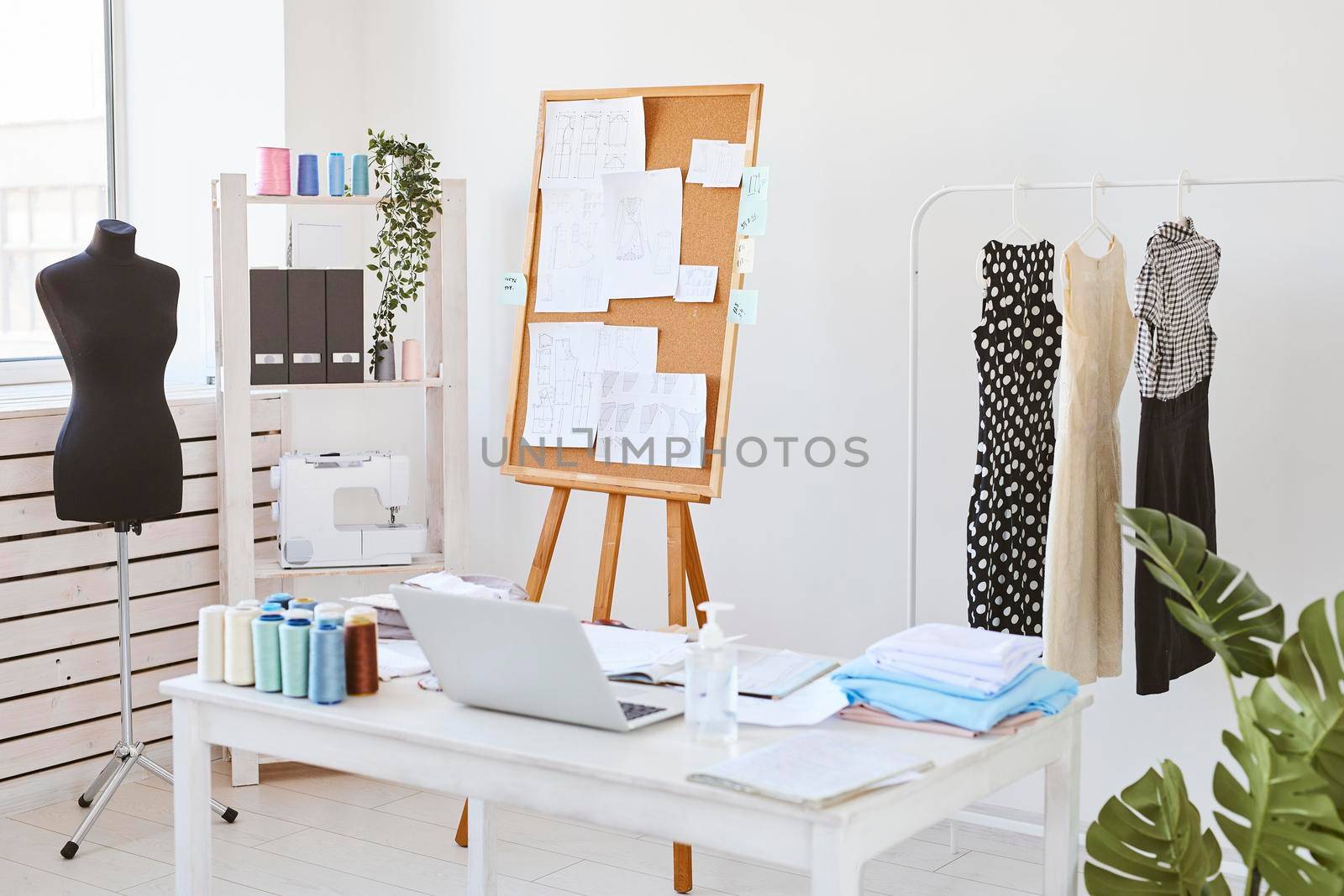 fashion atelier idea board desk clothing line. High resolution photo