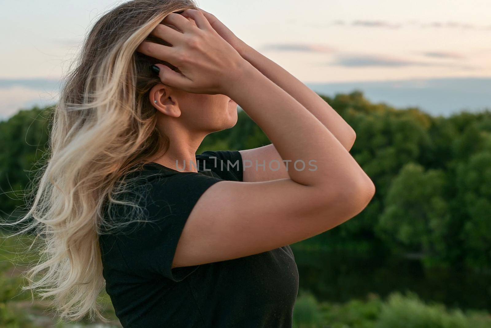 portrait of a beautiful European girl with loose hair against the background of nature. selective focus