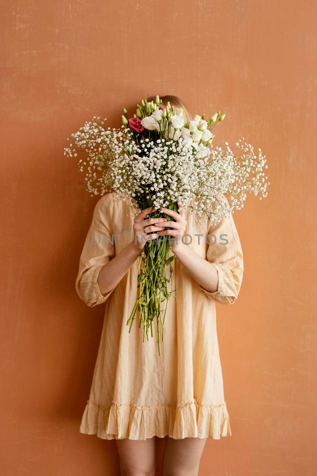 front view woman holding bouquet gorgeous spring flowers. High quality photo by Zahard