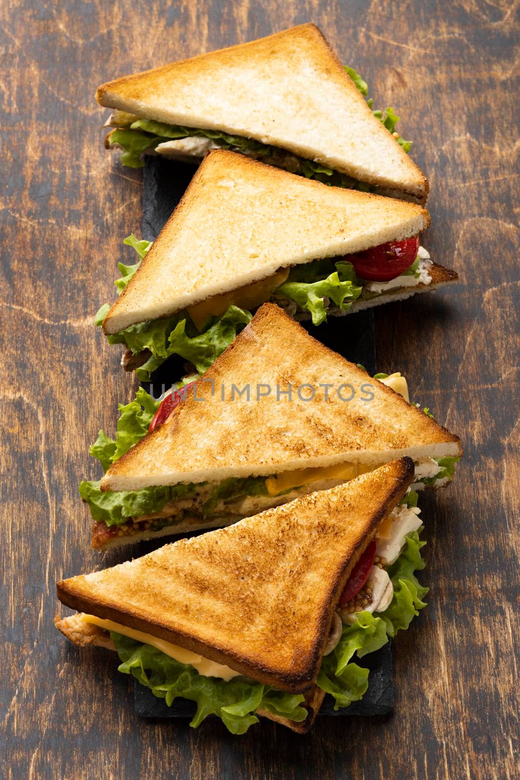 high angle triangle sandwiches with tomatoes. High quality photo by Zahard