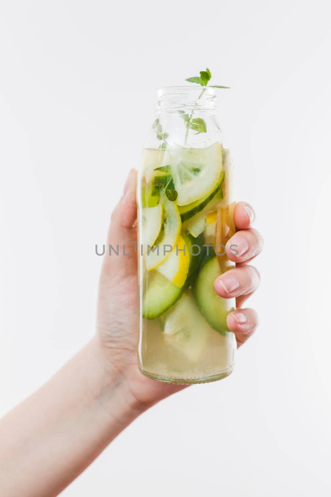hand with bottle fruit lemonade. High resolution photo