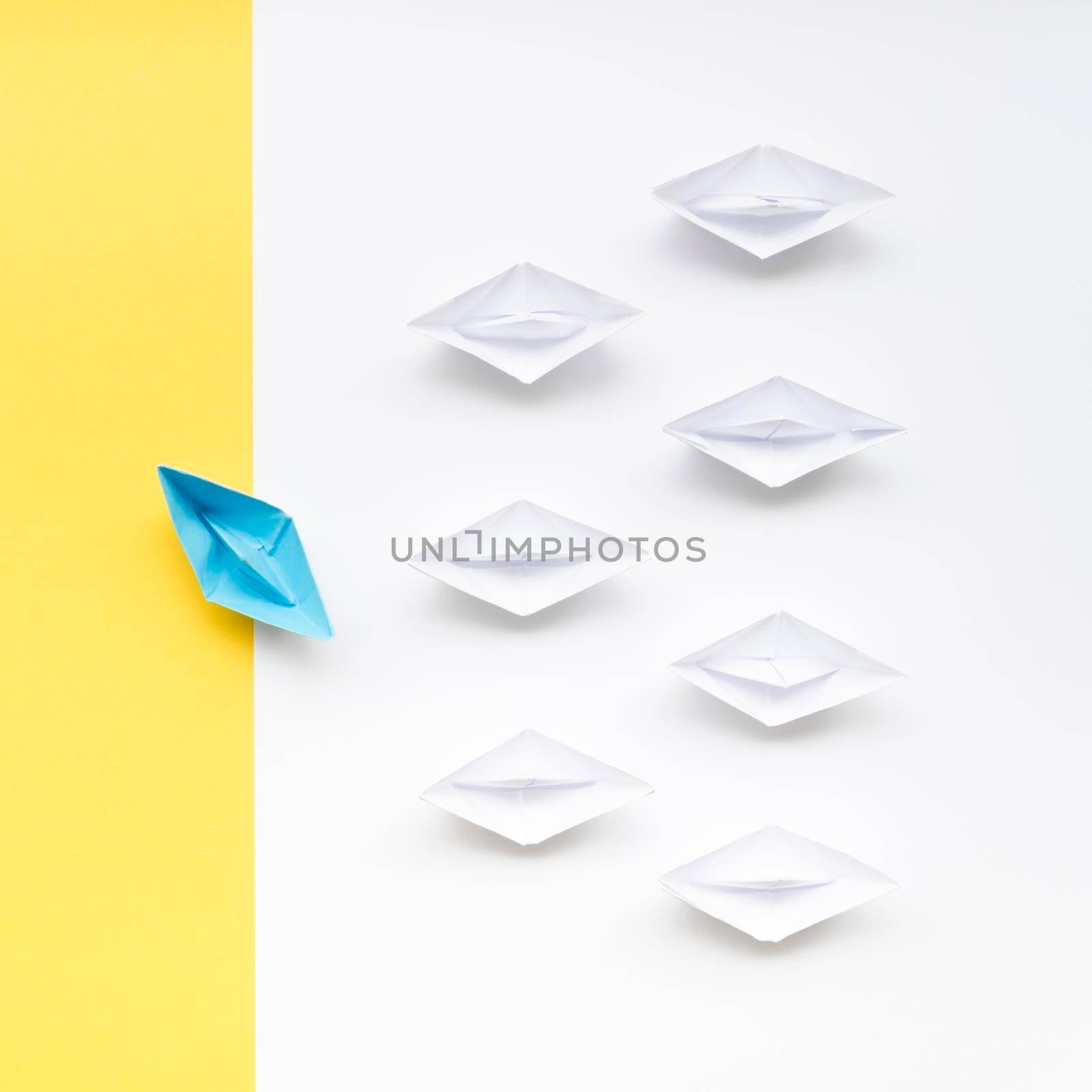 creative arrangement individuality concept paper boats. High resolution photo