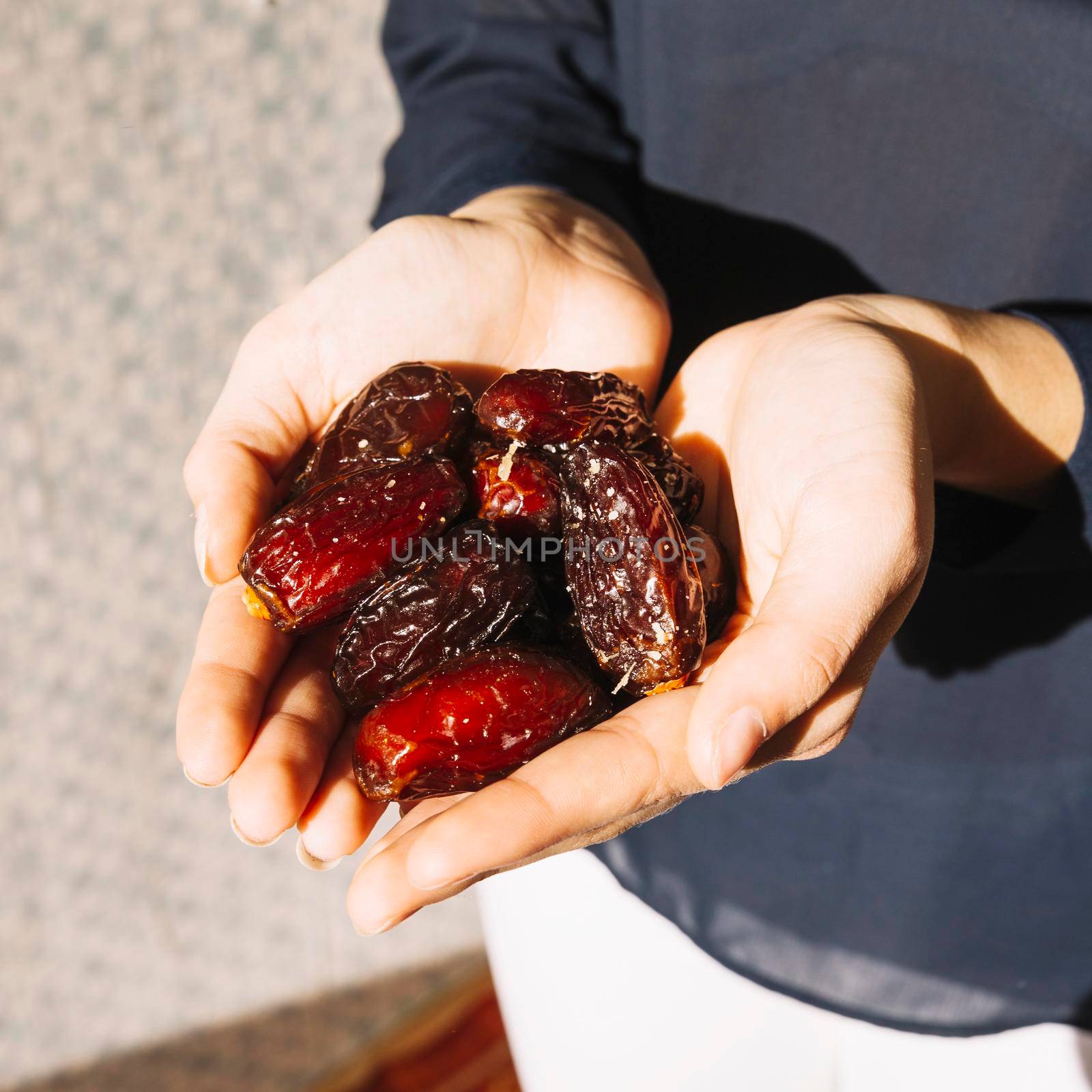 muslim woman with dates. High resolution photo