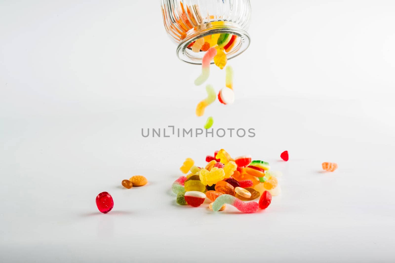 sweets spilling from jar. High resolution photo