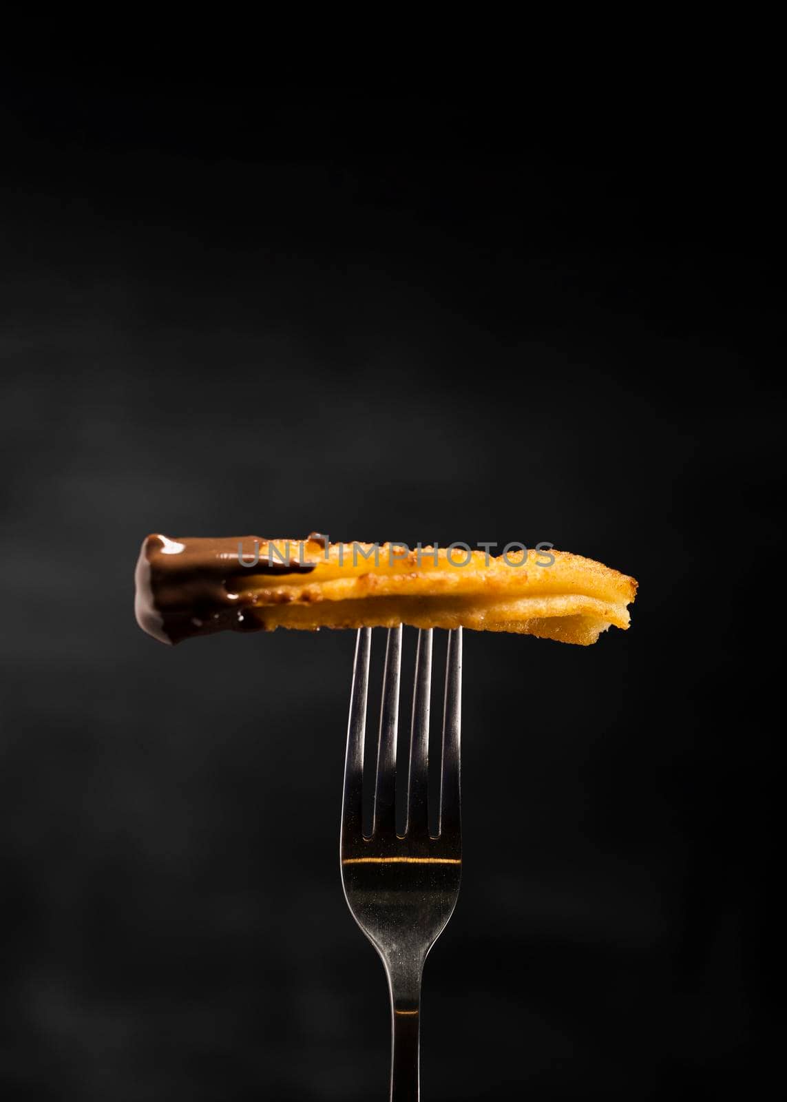 minimalist fried churros fork front view. High resolution photo