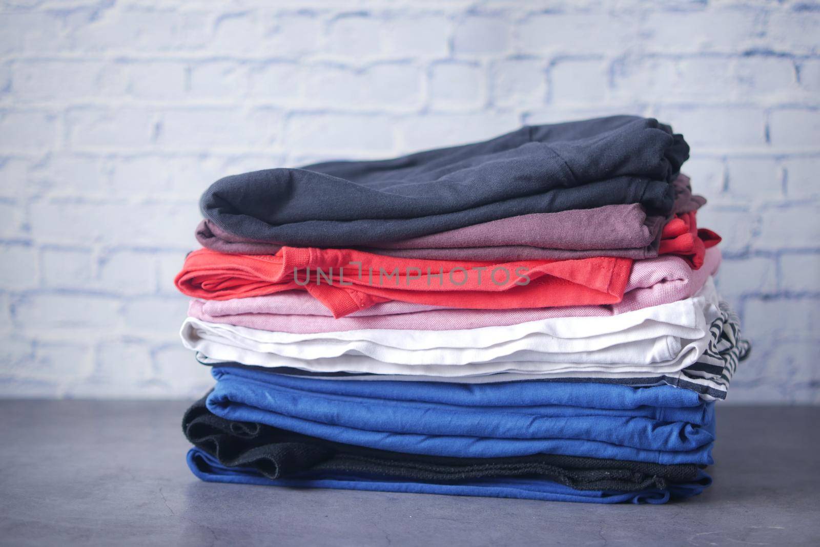 close up of stack of clothes on table