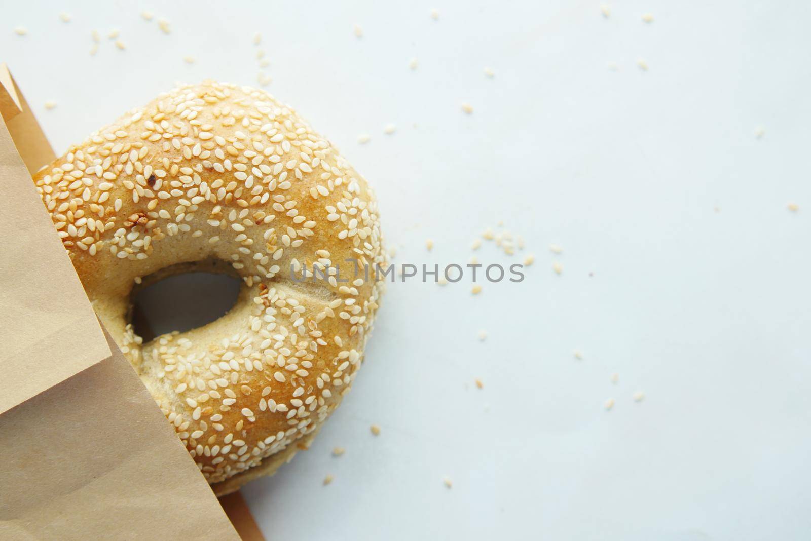 bagel and paper packet on white background by towfiq007