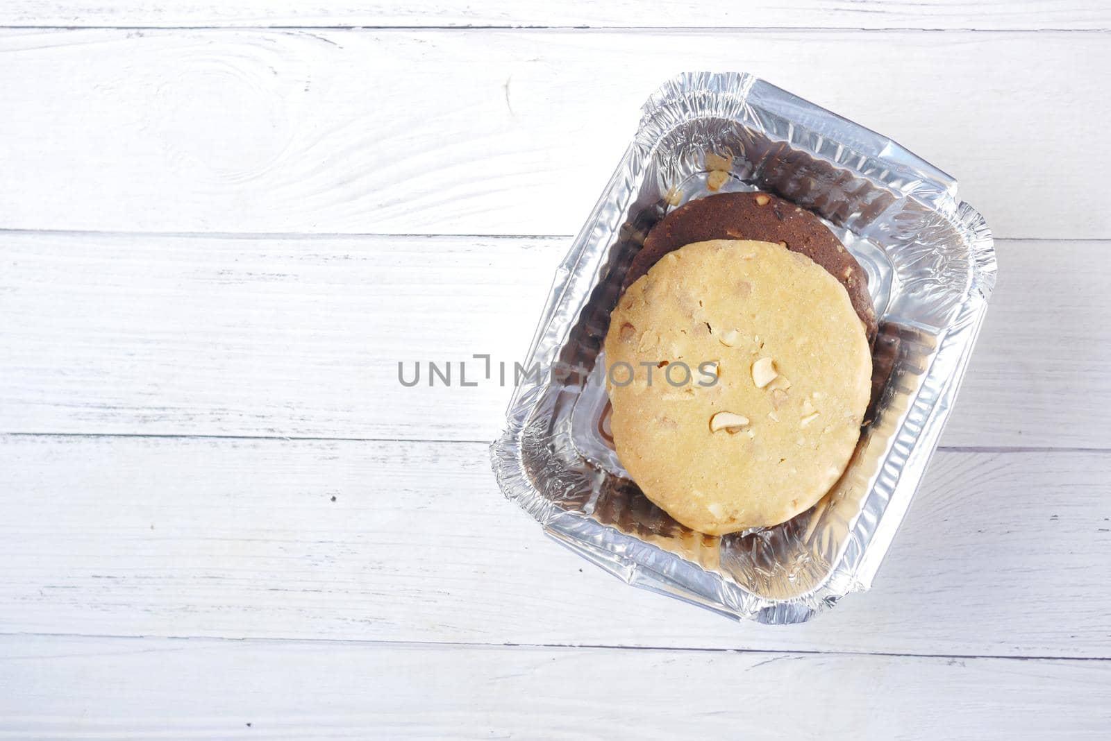 close up of sweet cookies on wooden table .