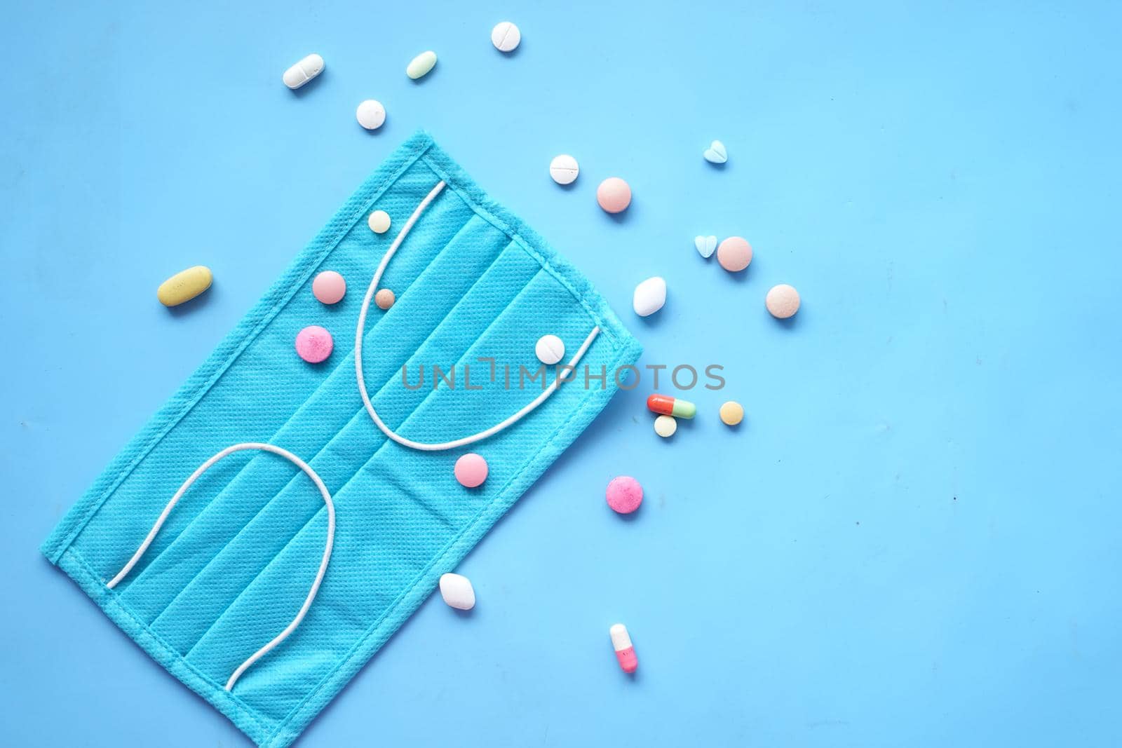 Close up of blue surgical masks on table.